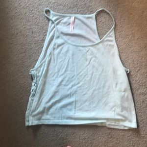 Sports wear tank top. Has crosses down the sides.